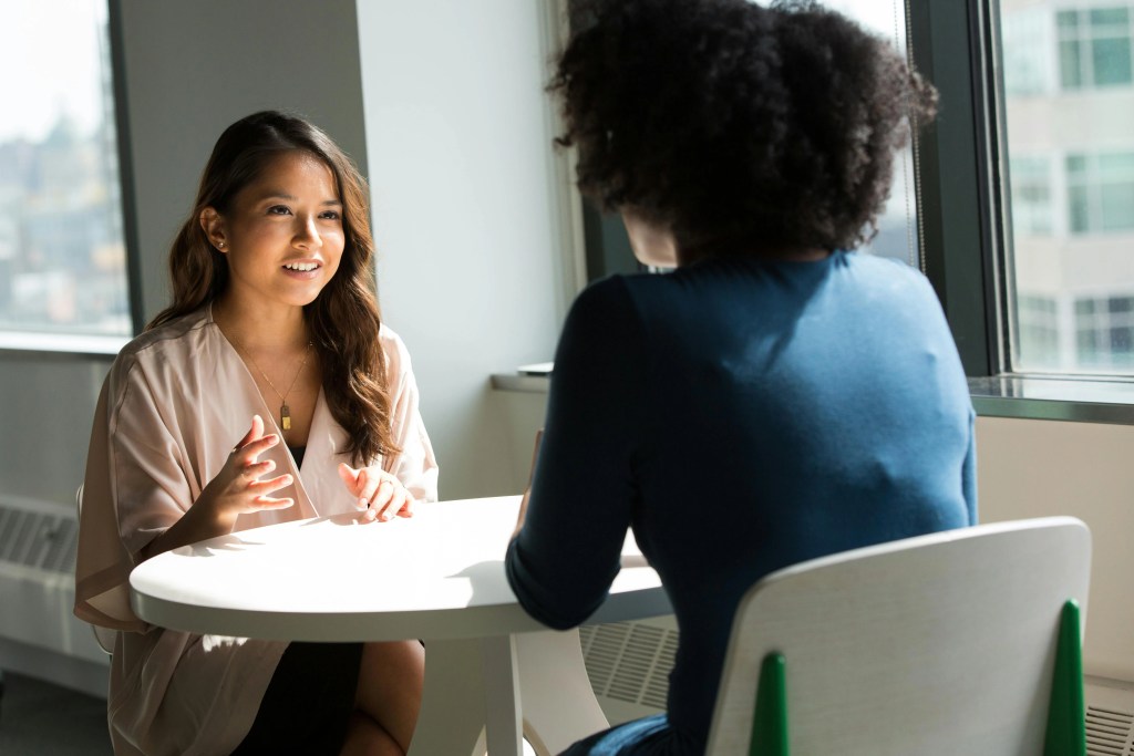 A young Vietnamese woman having a meeting to get services.
